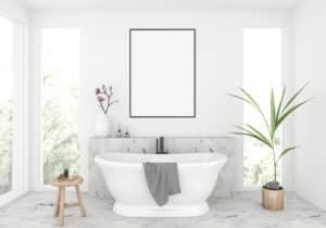 This image features a white stand alone bathtub.